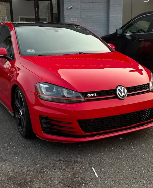 Red Volkswagen GTI after exterior detailing